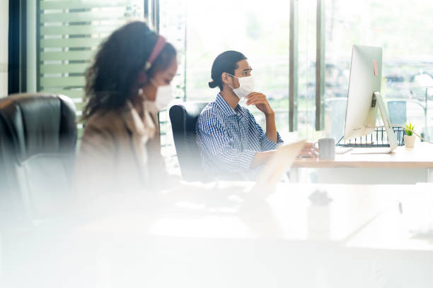 istock Asain employee face mask in new normal office 1270274559
