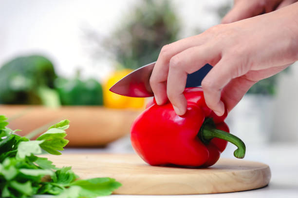 istock Chef cooking vegan food. Chef preparing vegetables in kitchen 1270276163