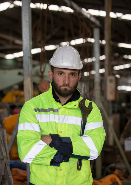 istock Engineer standing with confident against machine environment in factory 1270276276