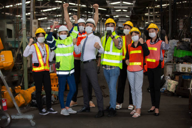 istock Closeup on Industrial Engineers hands as a team unity with Factory Worker. They Work at the Heavy Industry Manufacturing Facility. 1270276328