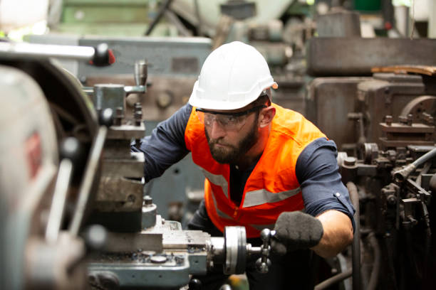 istock Engineers operating a cnc machine in factory 1270276392