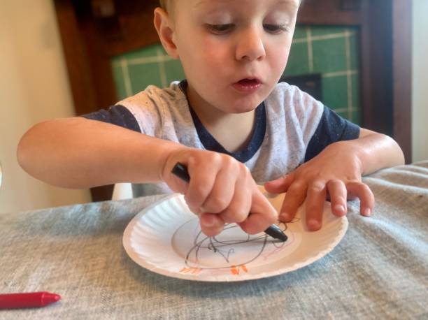istock Happy Toddler Boy doing Arts and Crafts 1270277604