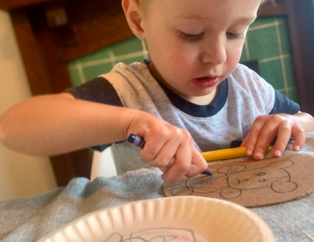 istock Happy Toddler Boy doing Arts and Crafts 1270277643