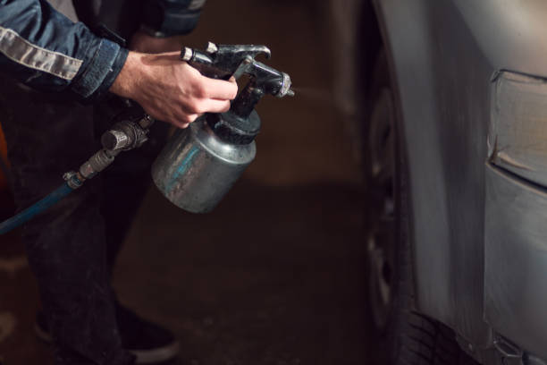istock Unrecognizable man painting car 1270280339