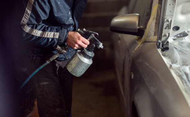 istock Unrecognizable man painting car 1270280460