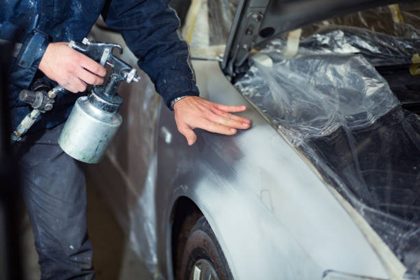 istock Unrecognizable man painting car 1270280547