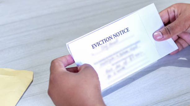 istock Hands of a man holds eviction notice letter 1270281393