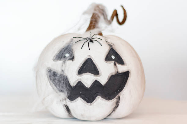 istock Scary pumpkin with with spider web and spider. Halloween concept 1270282664