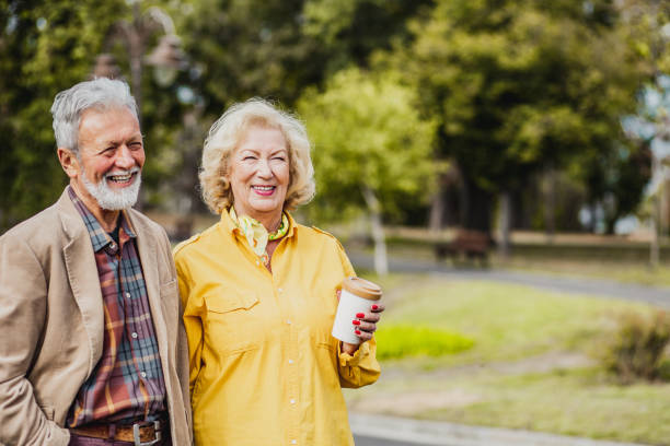 istock Senior couple walking in park 1270282938