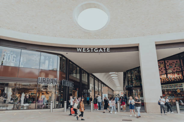 People walking by the entrance of The Westgate Shopping in Oxford, UK. stock photo