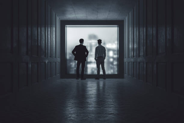 istock Businessmen talking in the dark 1270284232