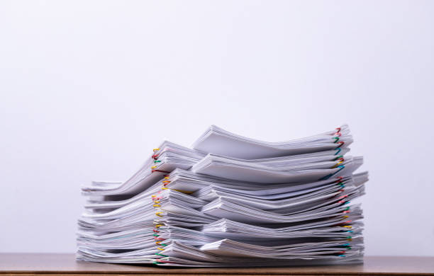 istock Stack of paper with copy space on white background, business concept. 1270284881