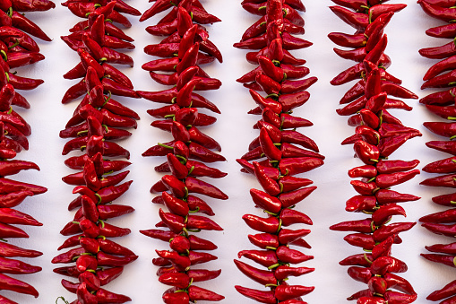 Ezpeleta, red hot peppers drying on basque house wall