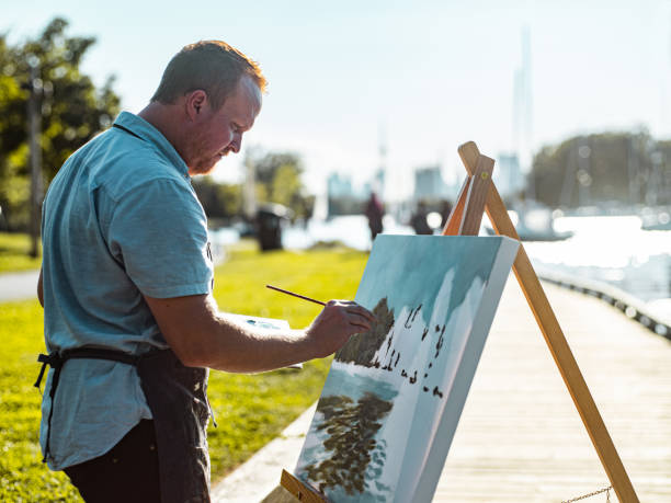 istock Man painting at the Lake shore 1270285908