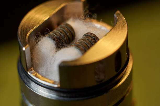 istock Vape RDA or e-cigarette for vaping with coils and cotton, rebuildable dripping atomizer or vaporizer. 1270287458