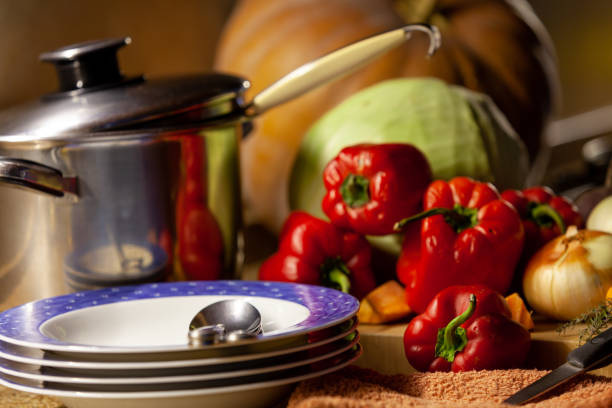 istock Plates, pans and set of vegetables 1270288321