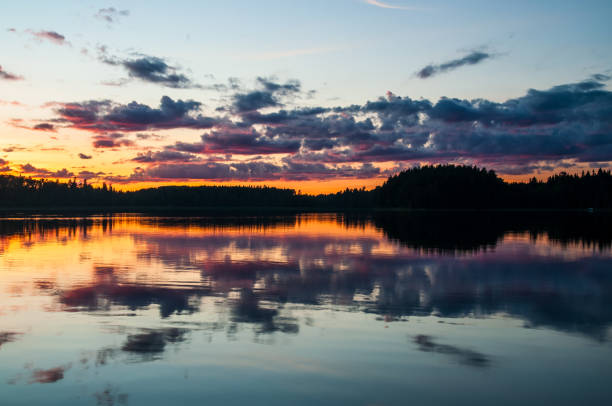 istock gorgeous evening landscape with clouds reflecting in the water surface 1270291021