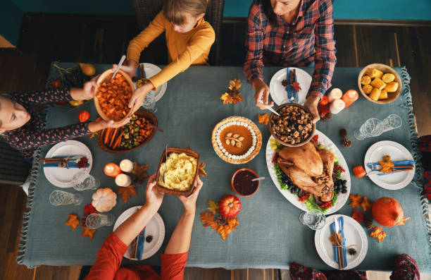 istock Family Having Traditional Holiday Stuffed Turkey Dinner 1270292501