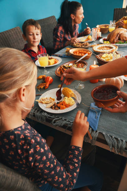 istock Family Having Traditional Holiday Stuffed Turkey Dinner 1270292622