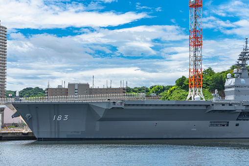 yokosuka, japan - july 19 2020: Close-up view of the Japanese Destroyer JS Izumo DDH-183, an helicopter and aircraft carrier of Japan Maritime Self-Defense Forces berthed in the Yokosuka naval port.