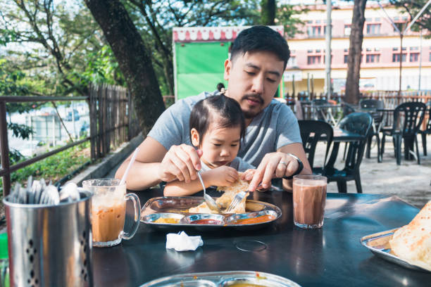 istock Dad and young son share meal 1270296298