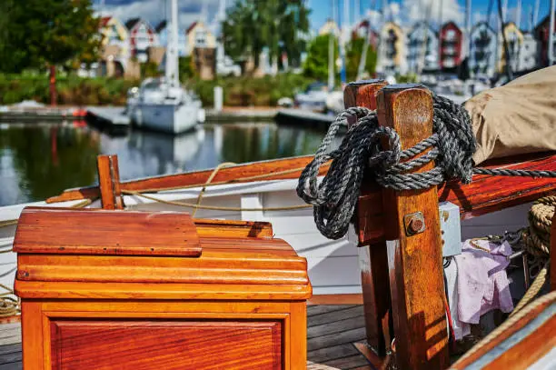 Details of a historic sailing boat anchored in the port of the hanseatic city of Greifswald in Germany.