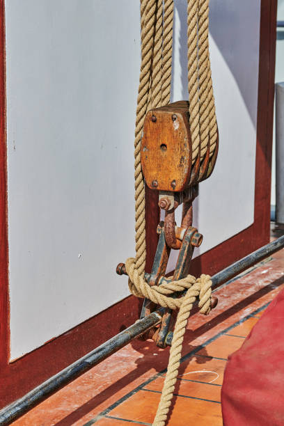 Details of a historic sailing boat anchored in the port of the hanseatic city of Greifswald in Germany.