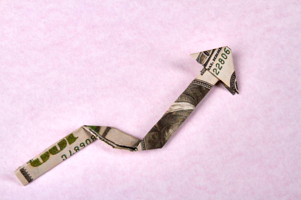 istock One hundred dollar bill arrow origami. 1270300230
