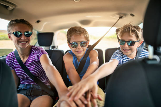 istock Happy kids travelling by car stacking hand. 1270300879