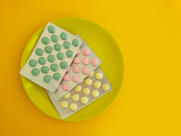 istock plate of pills vitamins on a colored background 1270301030
