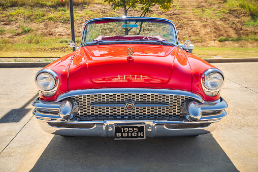 Westlake, United States - October 19, 2019: Front view of a red vintage 1955 Buick convertible classic car.