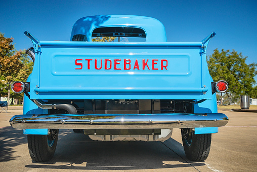 Westlake, United States - October 19, 2019: Back side view of a light blue color vintage Studebaker pickup truck classic car.