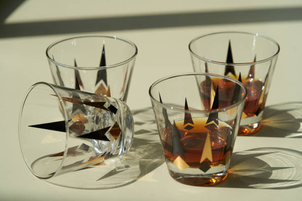 istock Glass of scotch whiskey or cognac on bright background with copy space, 1270303621