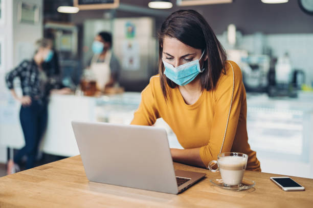 istock Anxious woman looking at a laptop in cafeteria 1270305654