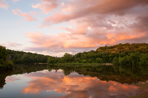 Reflection of sunset clouds in lake at Green Lane Park, Montgomery County , Pennsylvania, USA