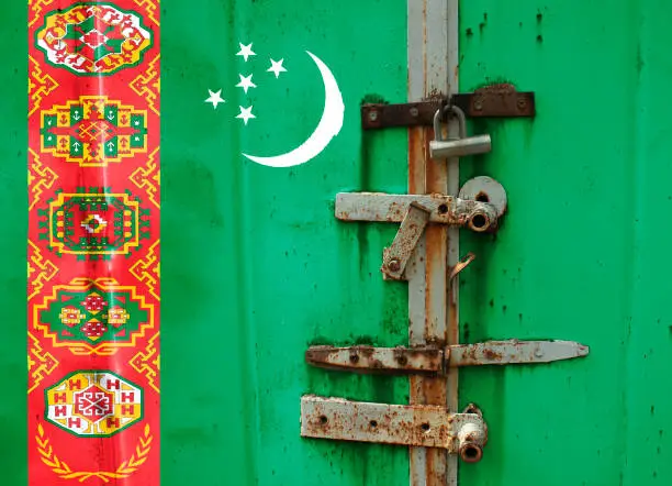 Photo of Flag of Turkmenistan is on texture. Template. Coronavirus pandemic. Countries may be closed. Locks.