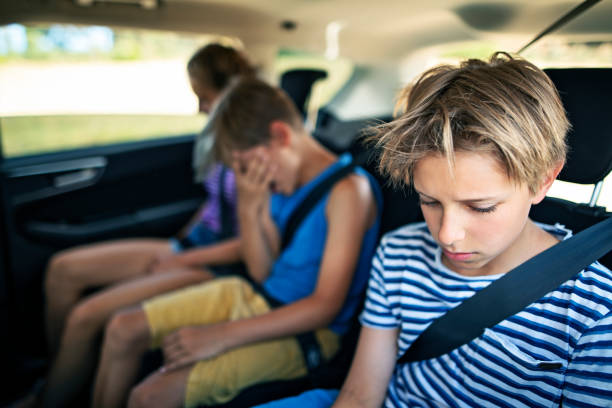 istock Kids on road trip not feeling well 1270307684