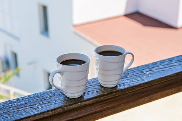 istock two coffee cup coffee cups in wooden balcony terrace 1270309776