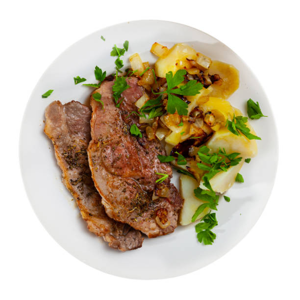 istock Pork chops with boiled potato, fried onion and parsley 1270310413