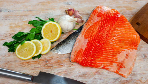 istock Fresh fillet salmon fish on wooden board 1270310420