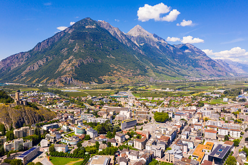 Picturesque aerial view of Martigny city in Rhone valley at foot of Swiss Alps