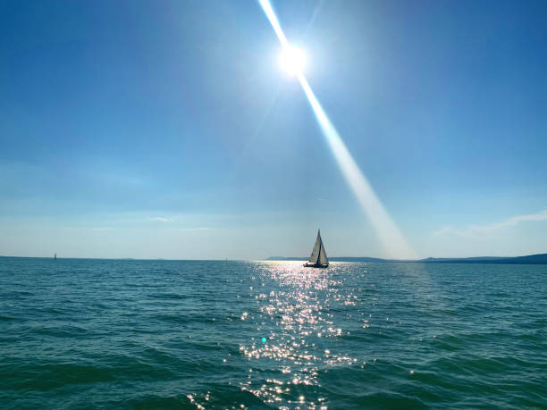 Europe’s largest fresh water lake in Hungary, summer of 2020 with beautiful blue water colours and fluffy clouds.