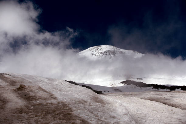 istock Climbing Elbrus. Snow-capped mountain peaks and climbers. 1270315716