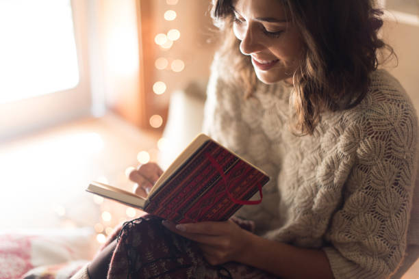 istock Woman writing on sketchbook 1270315860