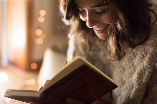 istock Woman writing on sketchbook 1270315865
