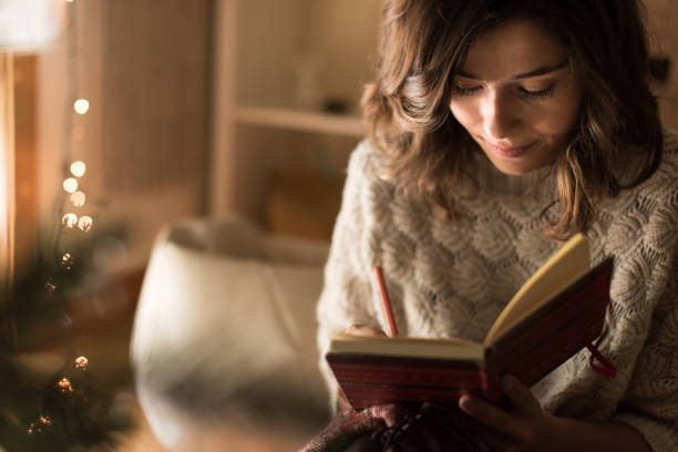 istock Woman writing on sketchbook 1270315872
