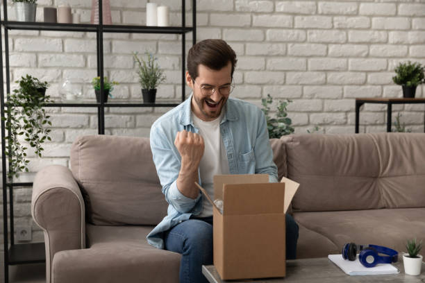 istock Excited man unpack order satisfied with quality product 1270316243
