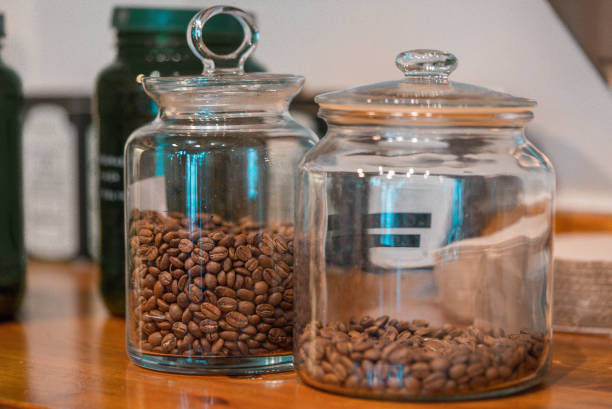 Roasted coffee beans in the glass bottle container