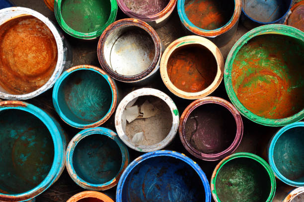 Old dirty metal paint cans as background stock photo