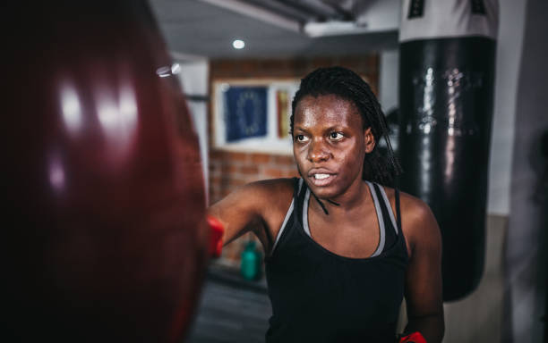 istock Woman boxing at the gym 1270326670